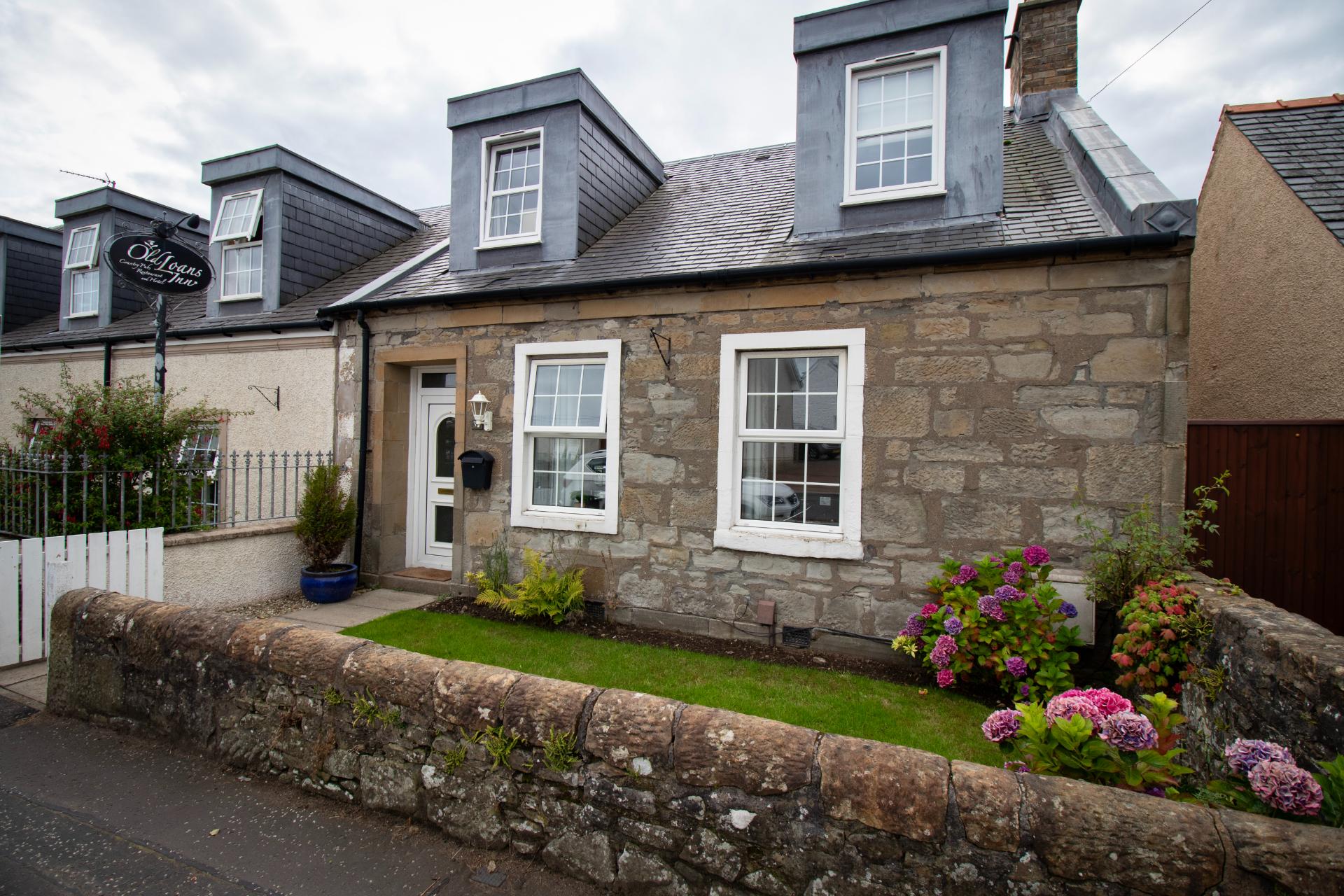 Exterior view of The Cottage self catering at The Loans Inn