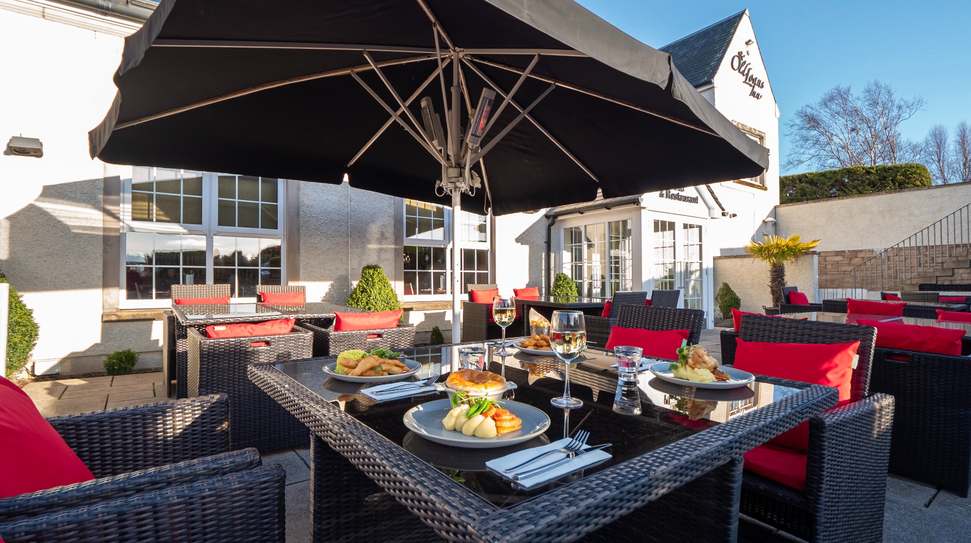 Food and drink on table in beer garden at The Loans Inn
